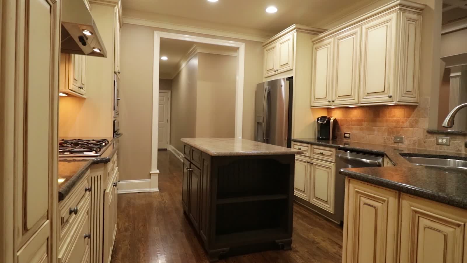 A renovated Burnaby kitchen with cabinetry and an island