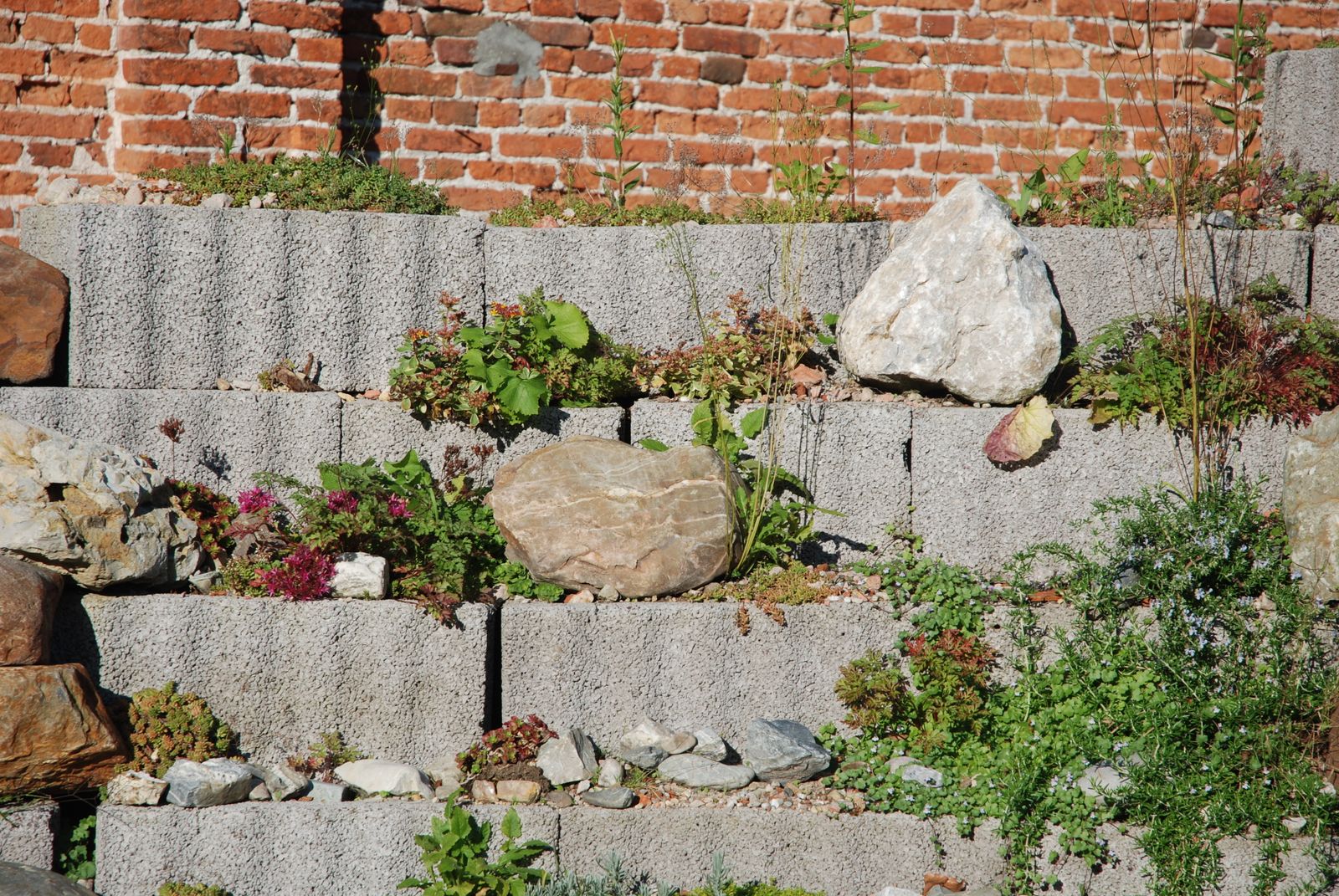 A segmental block retaining wall built into a graded slope