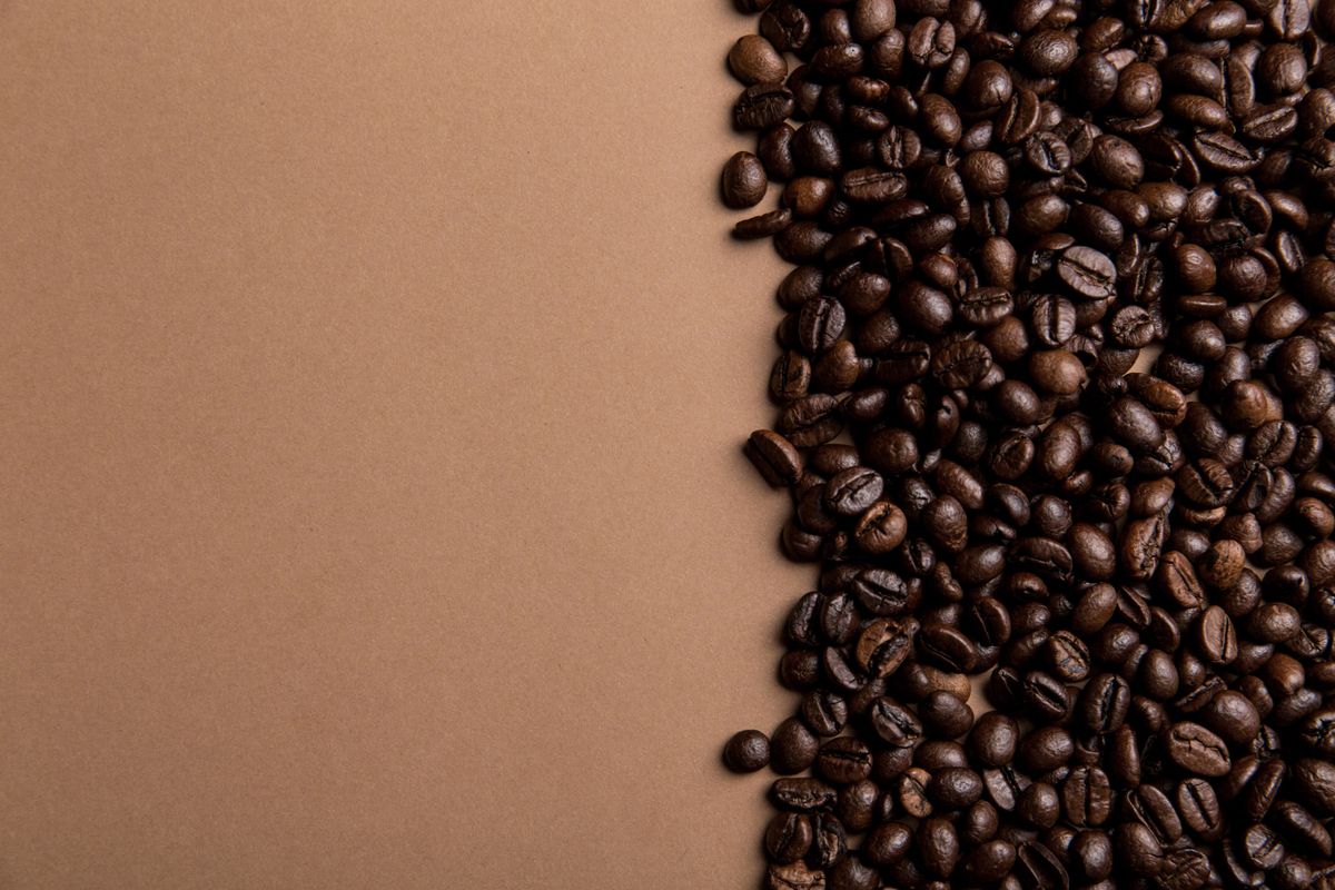 Roasted beans against a kraft-brown background