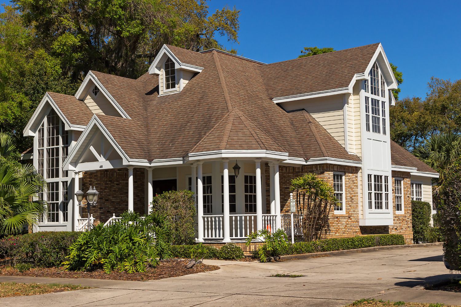 A finished residential roofline against a clear sky