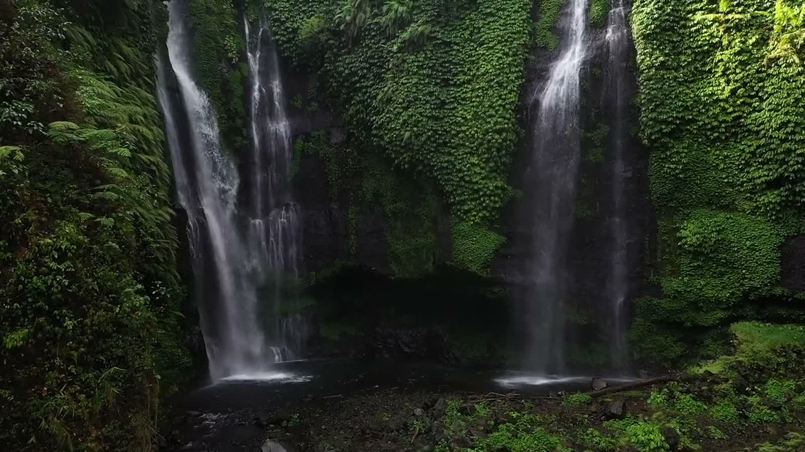 Water in steady motion over mossy rock