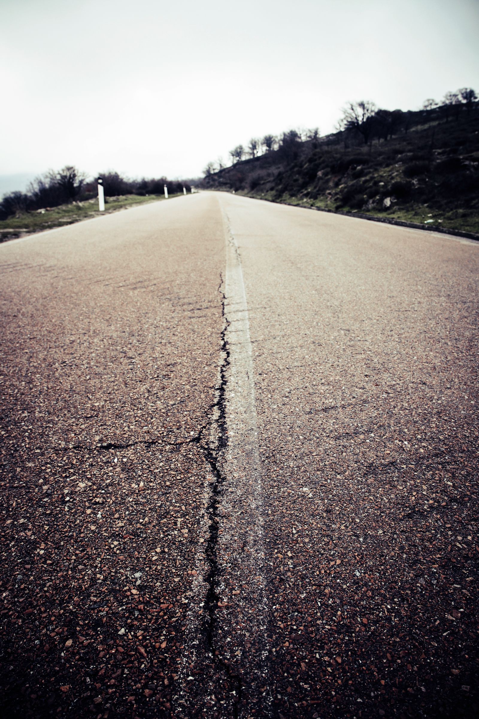 Cracked asphalt before repair