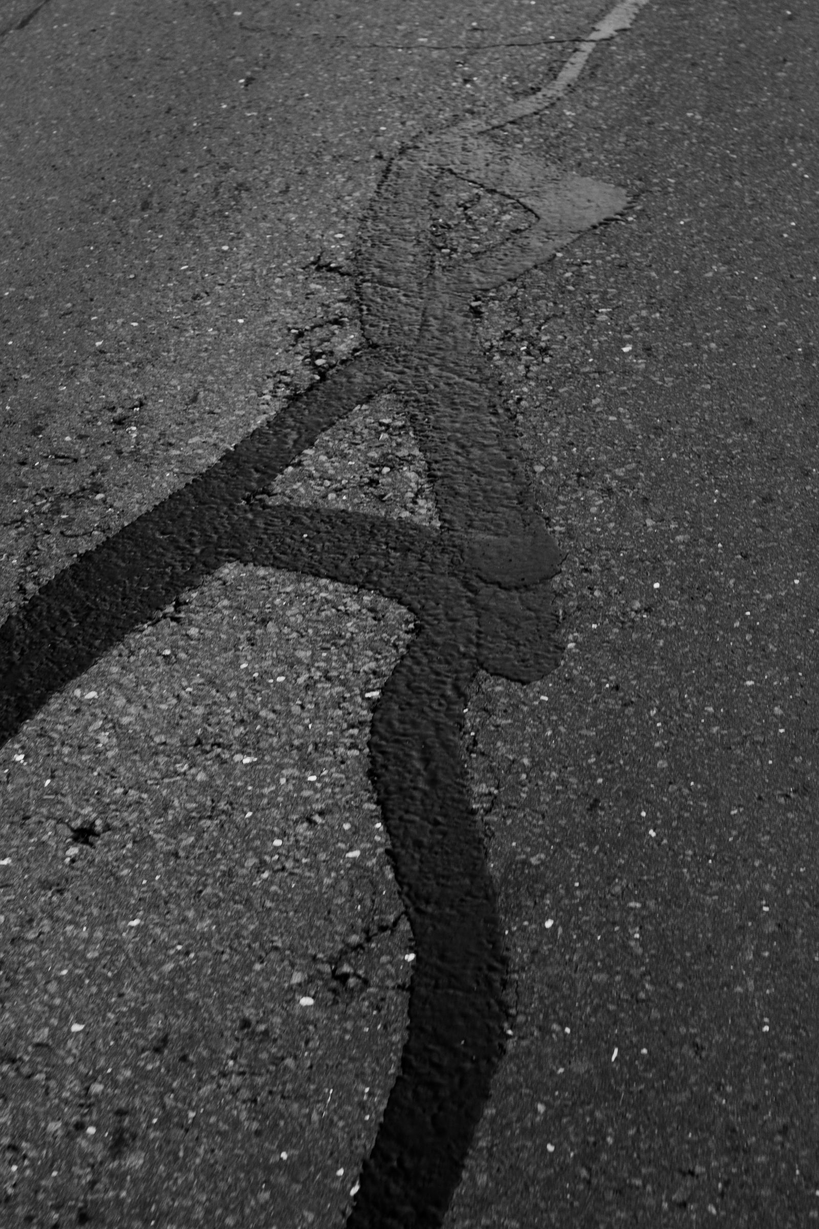 Cracked asphalt before repair