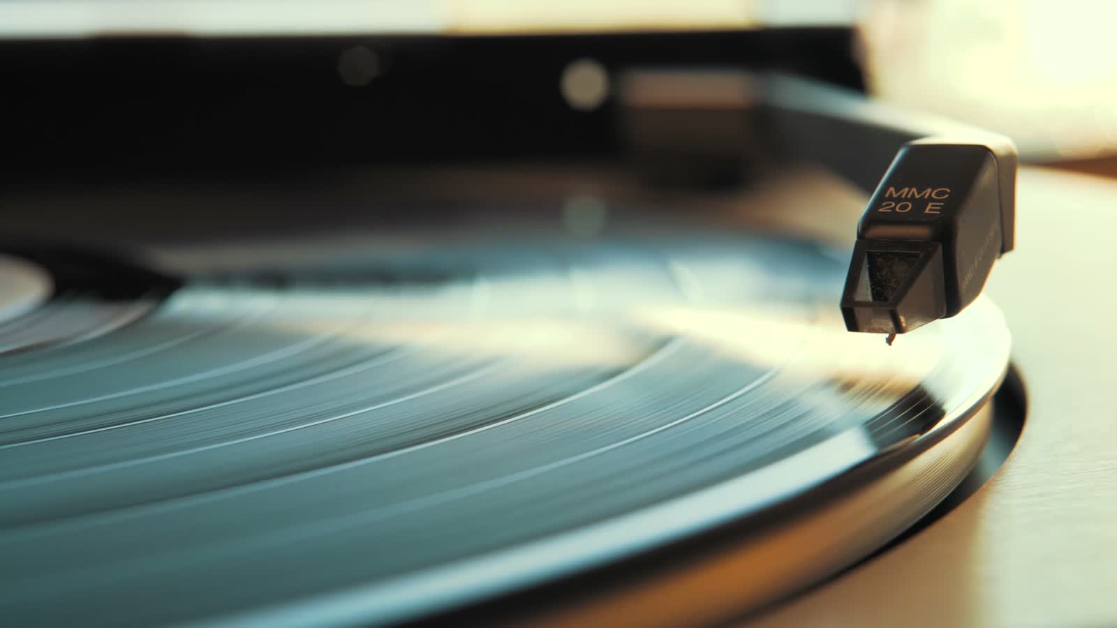 A stylus settling onto a spinning record