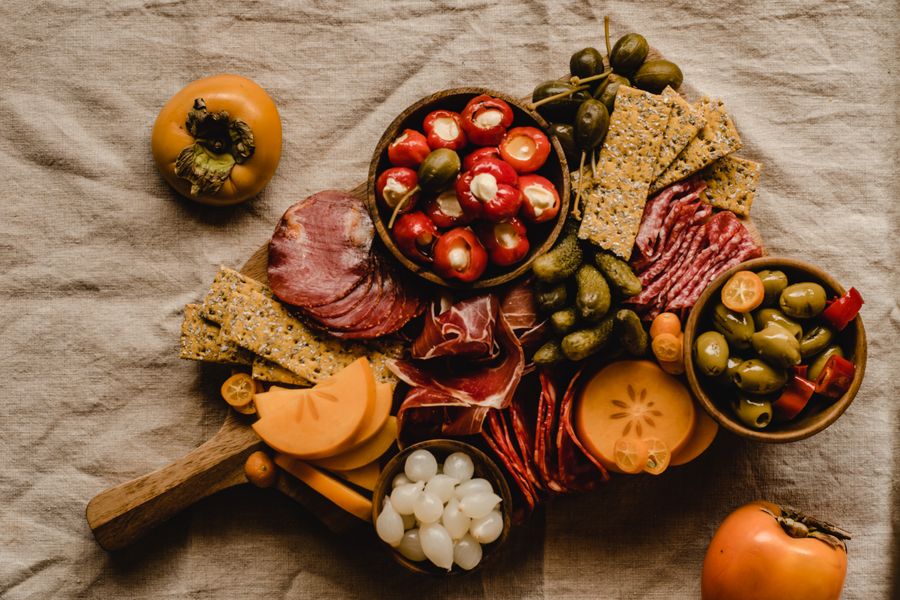 Italian antipasto board with cured meats, cheese and olives