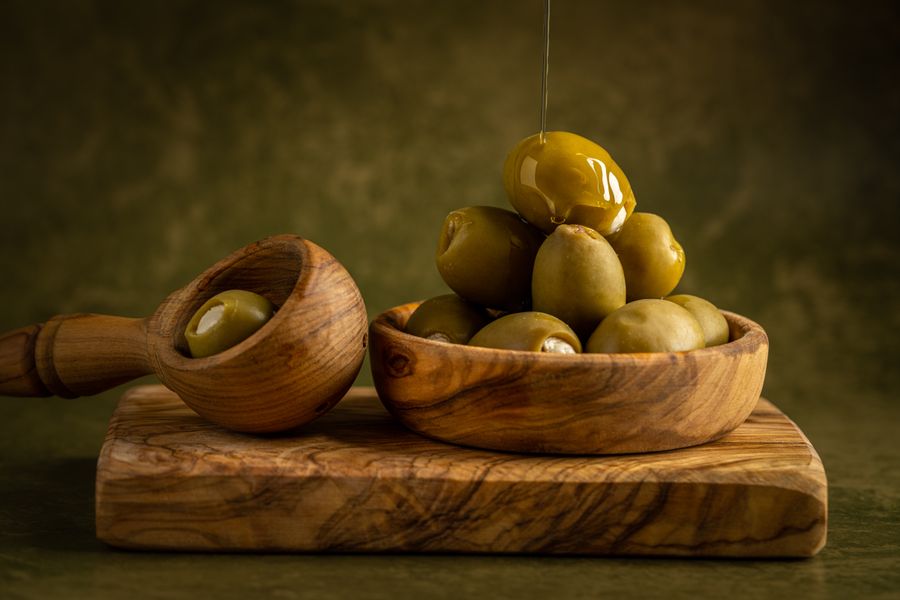 Marinated olives in wooden bowls