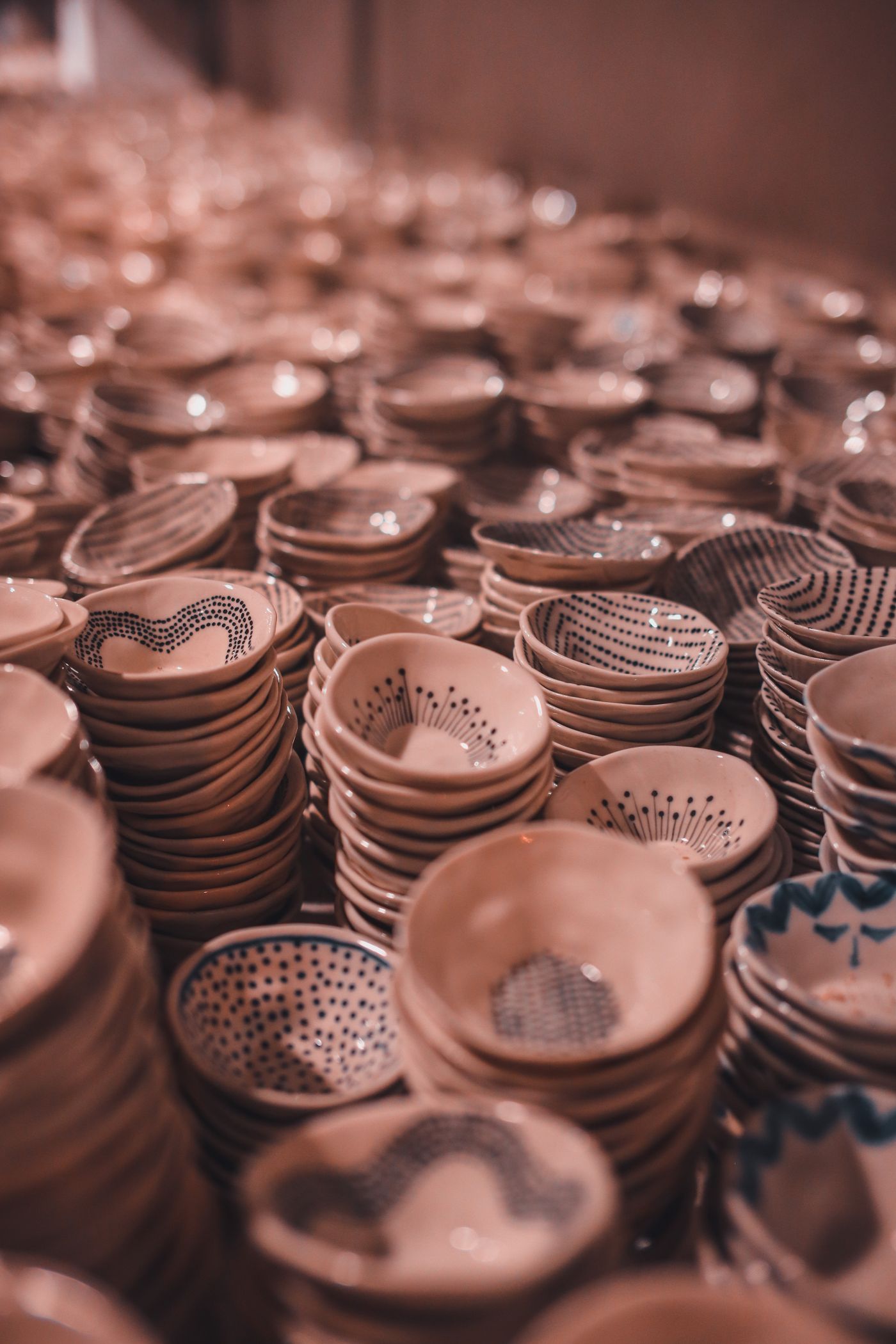 A warm stack of handmade ceramic bowls