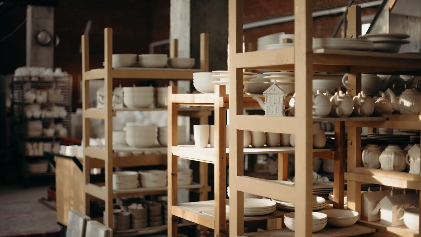 Shelves of handmade mugs and teapots