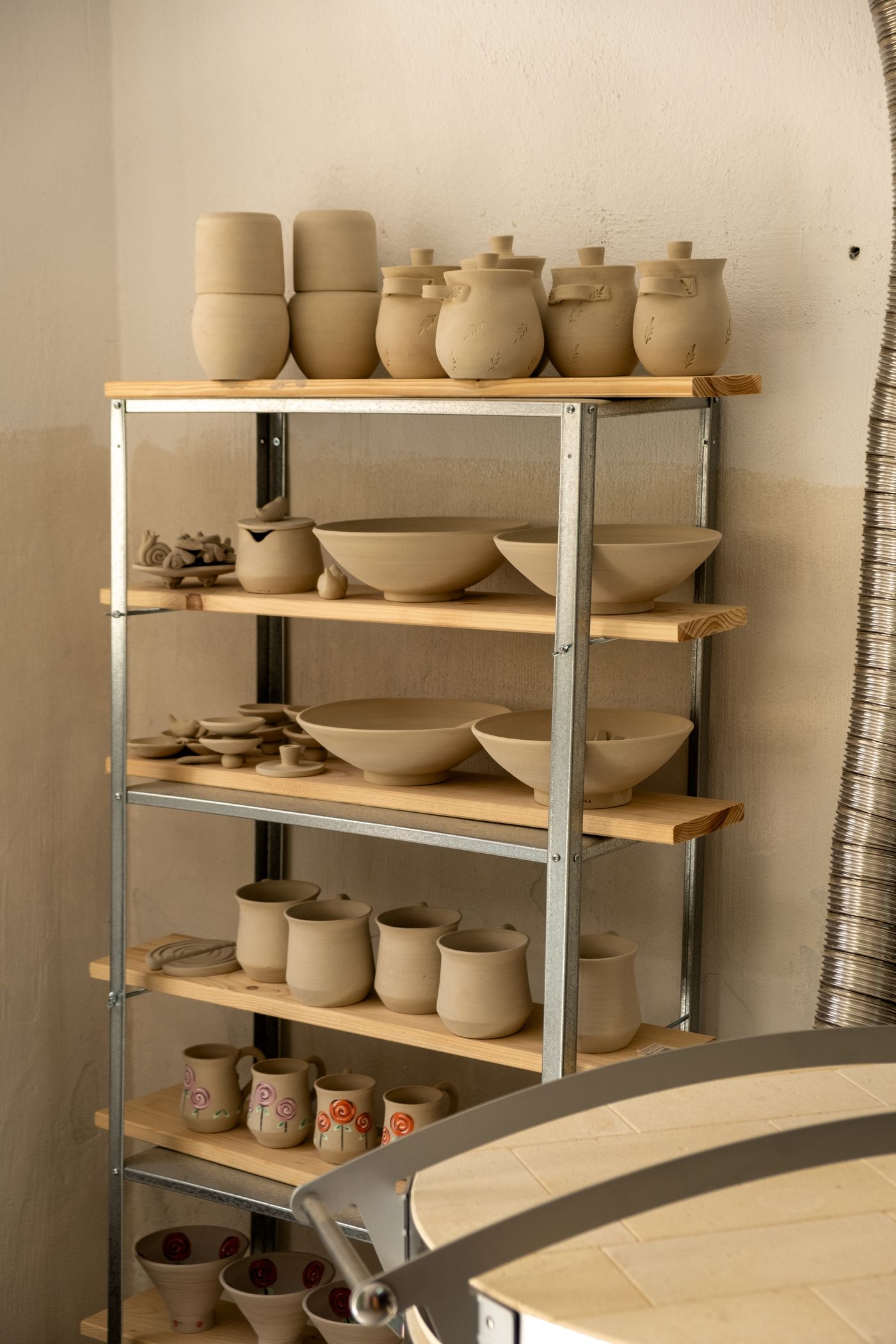 Shelves filled with handcrafted pottery
