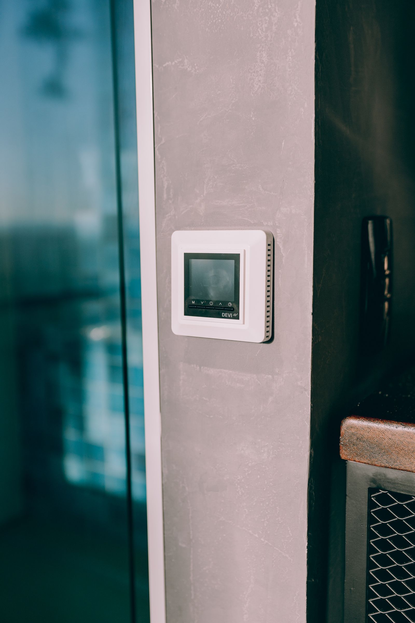 A wall-mounted thermostat