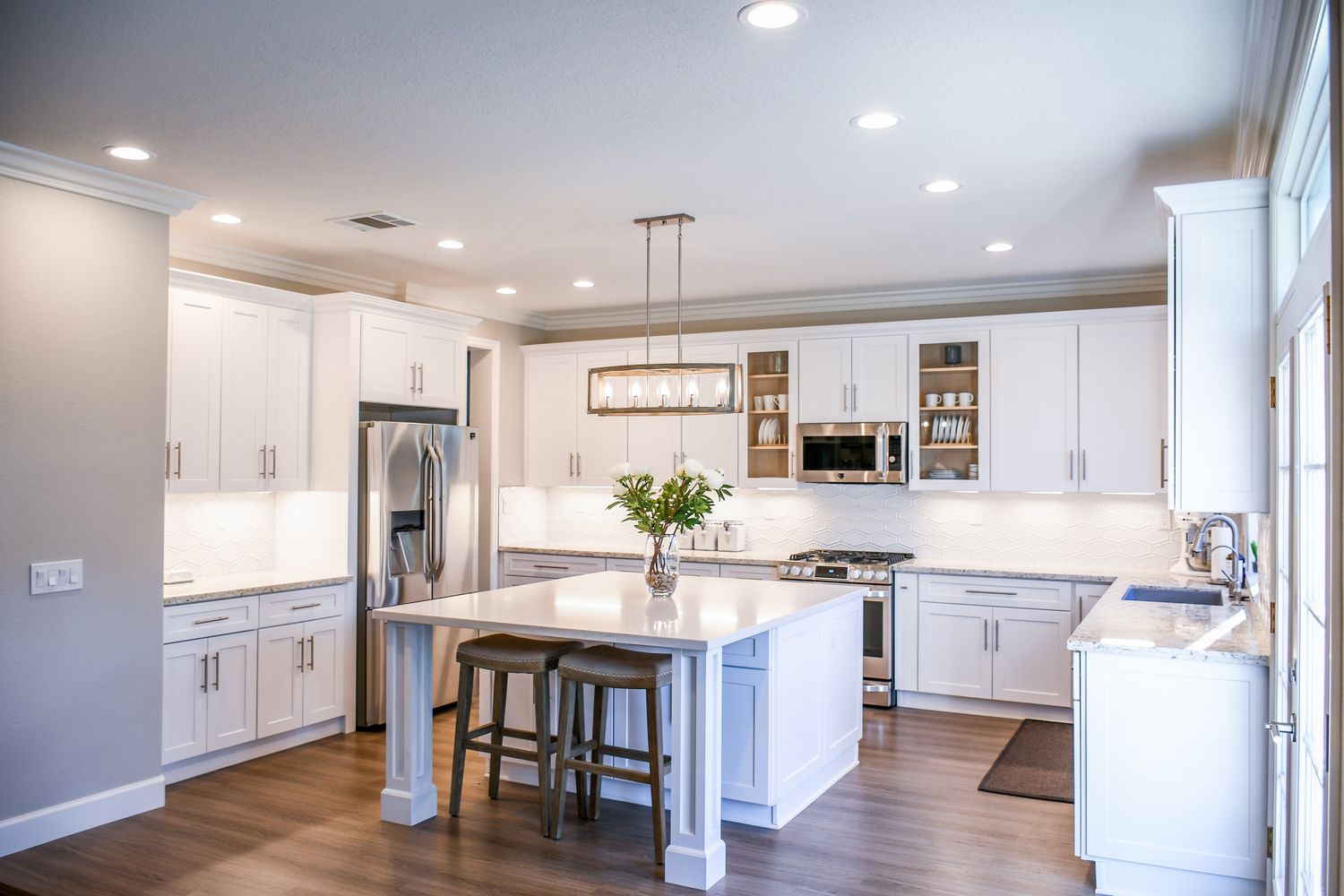Renovated kitchen cabinetry and stone counters