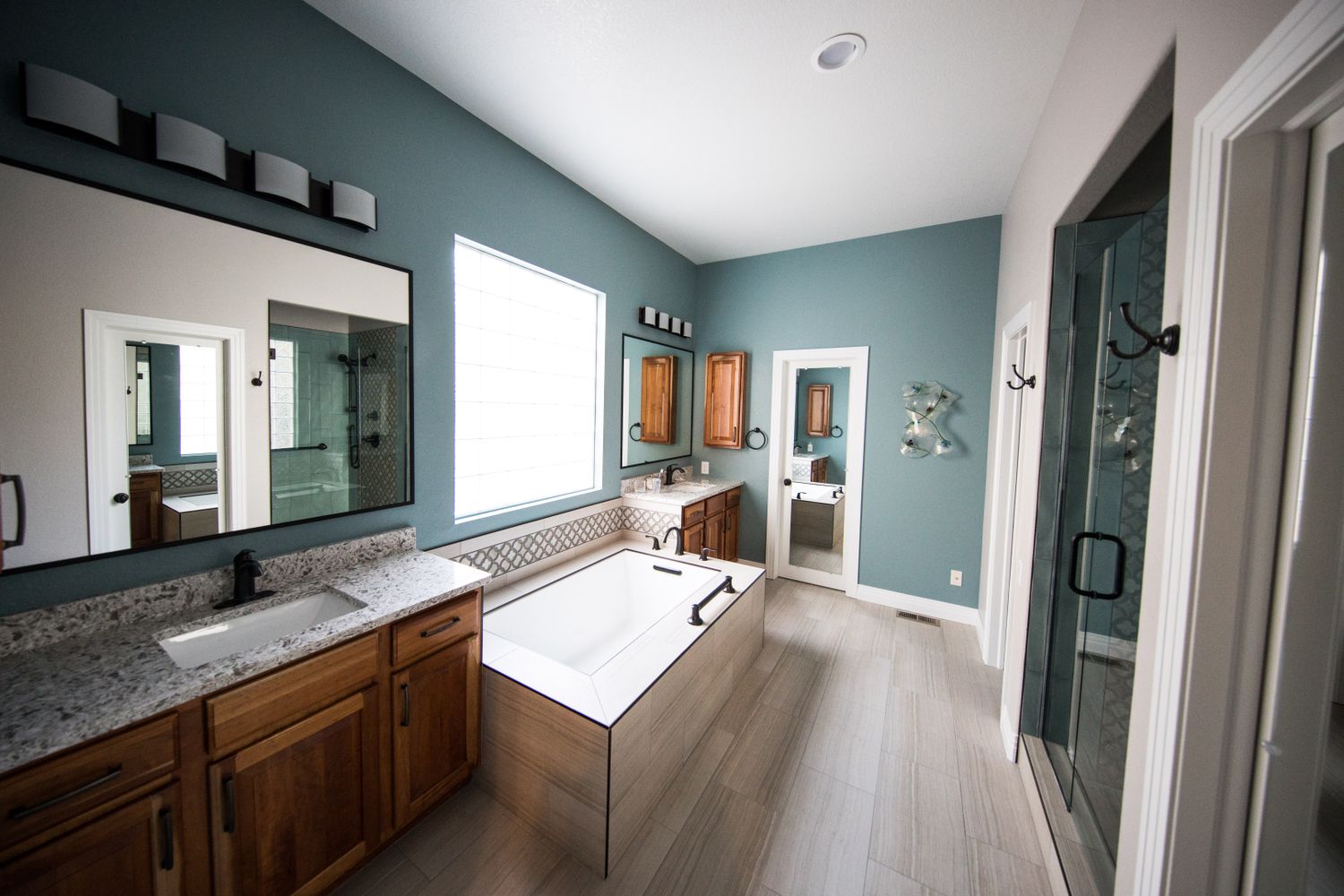 Renovated bathroom with tile, vanity and fixtures