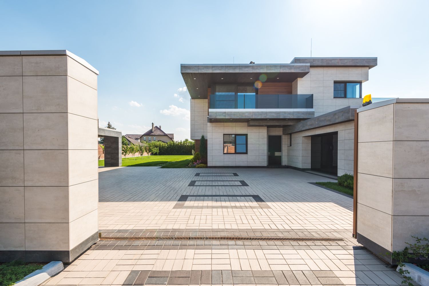 A home with a finished paved driveway
