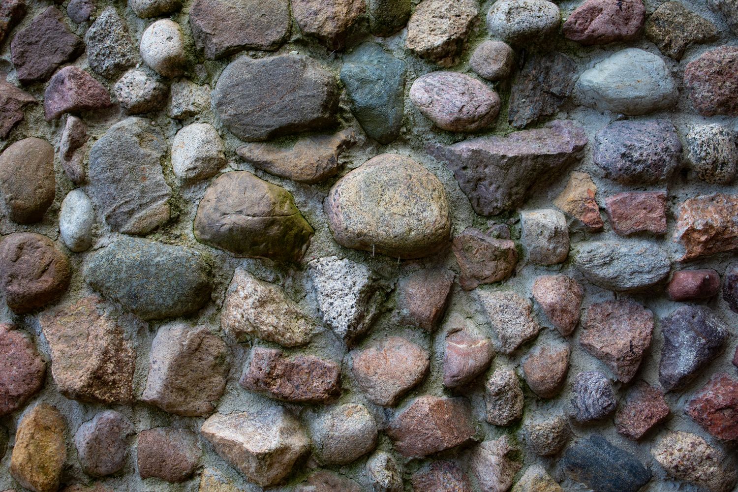 A stacked river-stone retaining wall