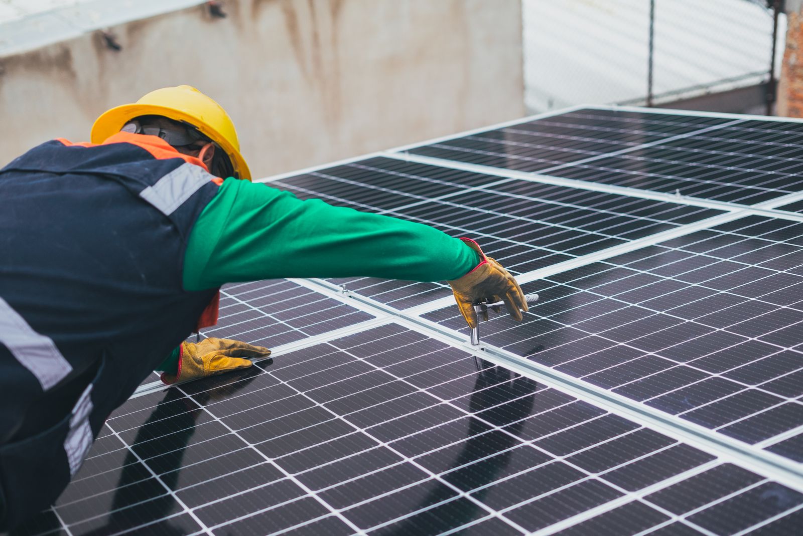 Hands installing a panel