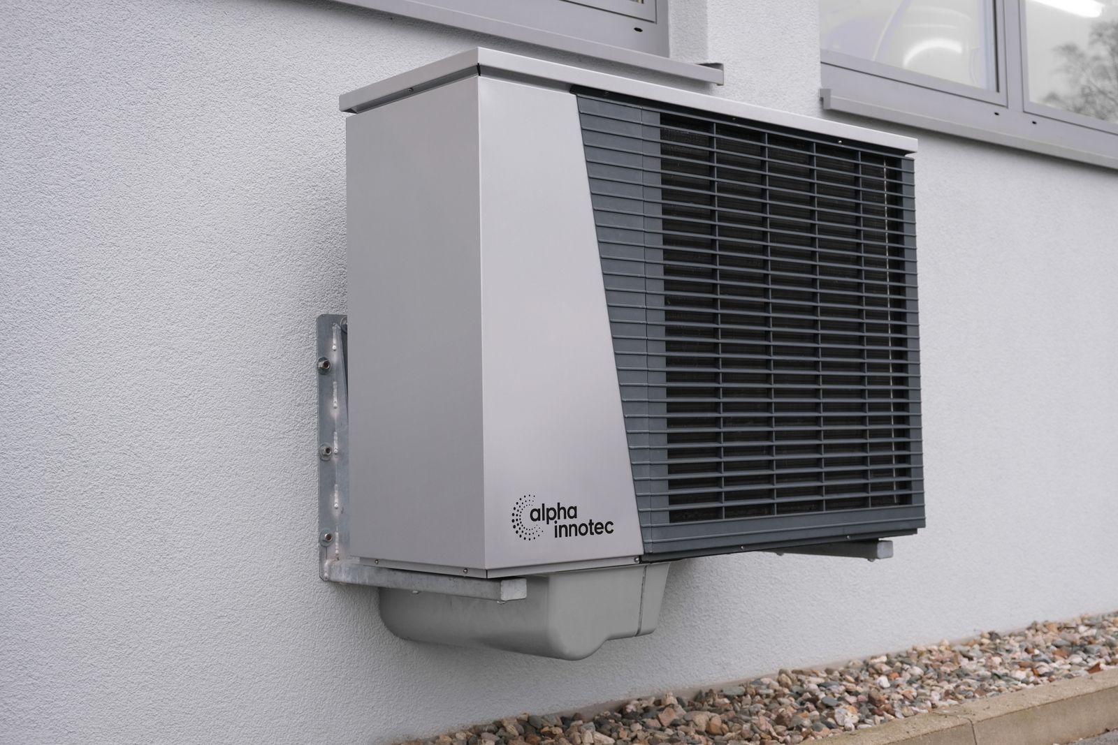 Outdoor condenser unit mounted on a building exterior