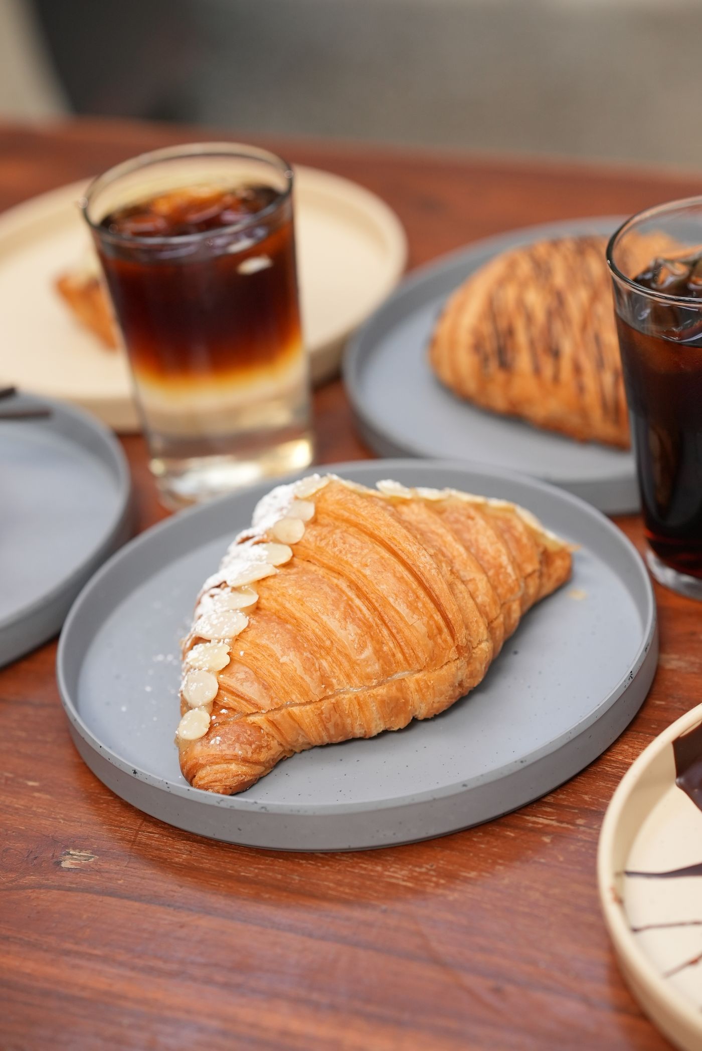 Almond croissant with a coffee