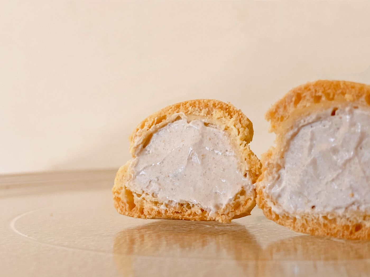 Cream puff split open to show the filling