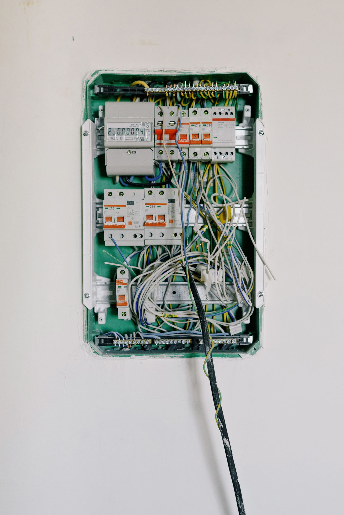 A neatly wired electrical panel with labeled, routed circuits
