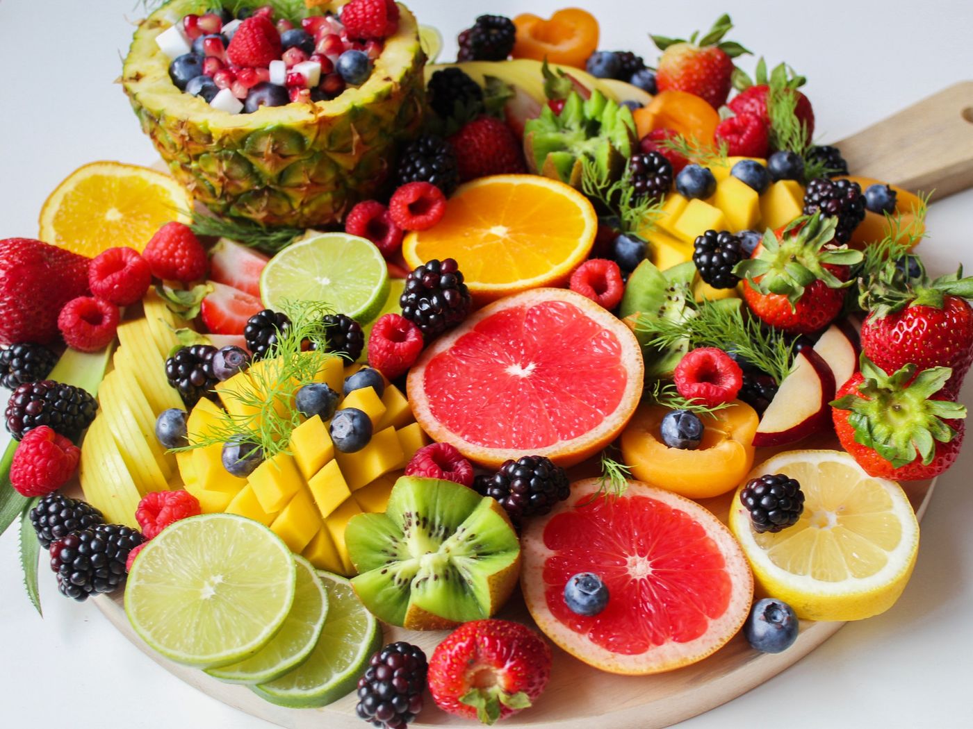 Sliced fresh fruit on a board