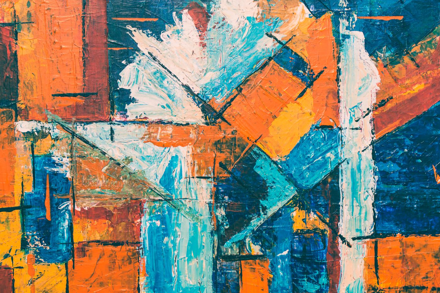 An abstract framed painting in orange and teal