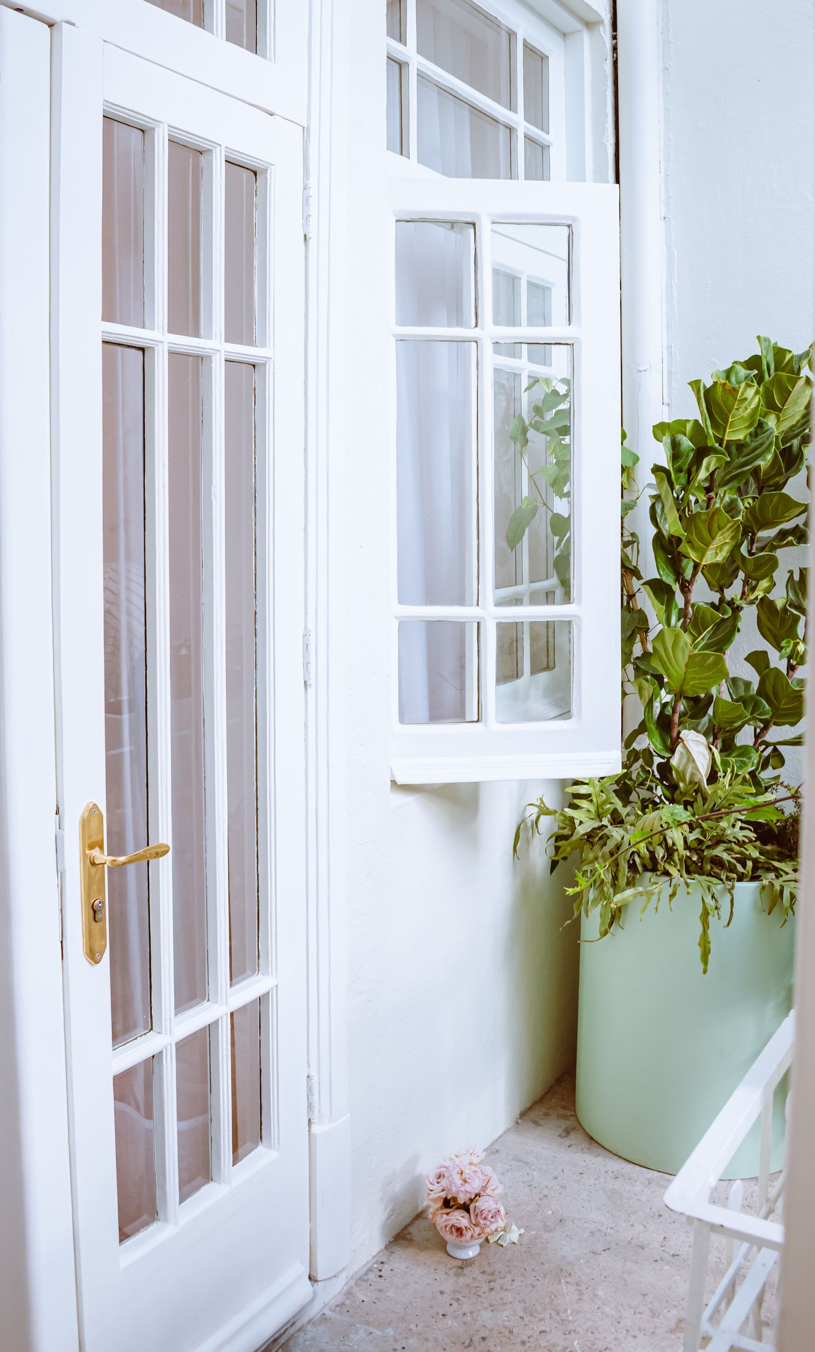 White French doors with greenery