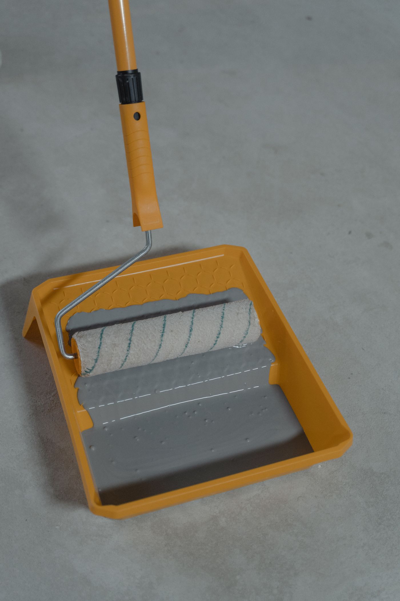 Roller and coating tray on concrete