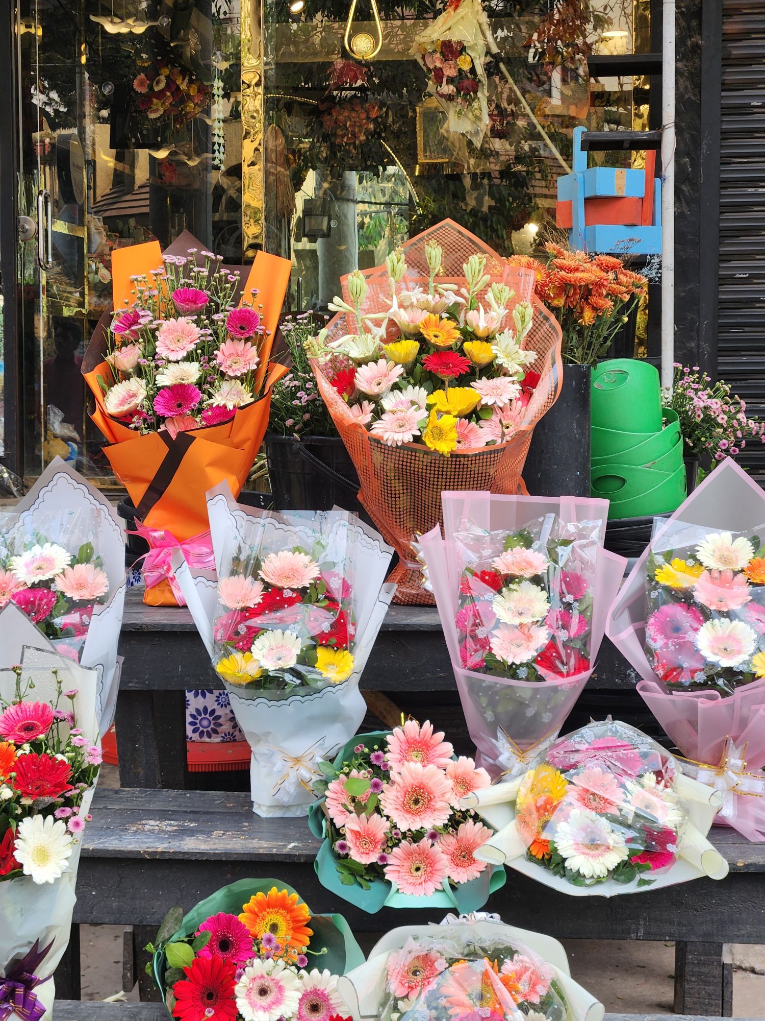 Bright bouquets on the shop steps