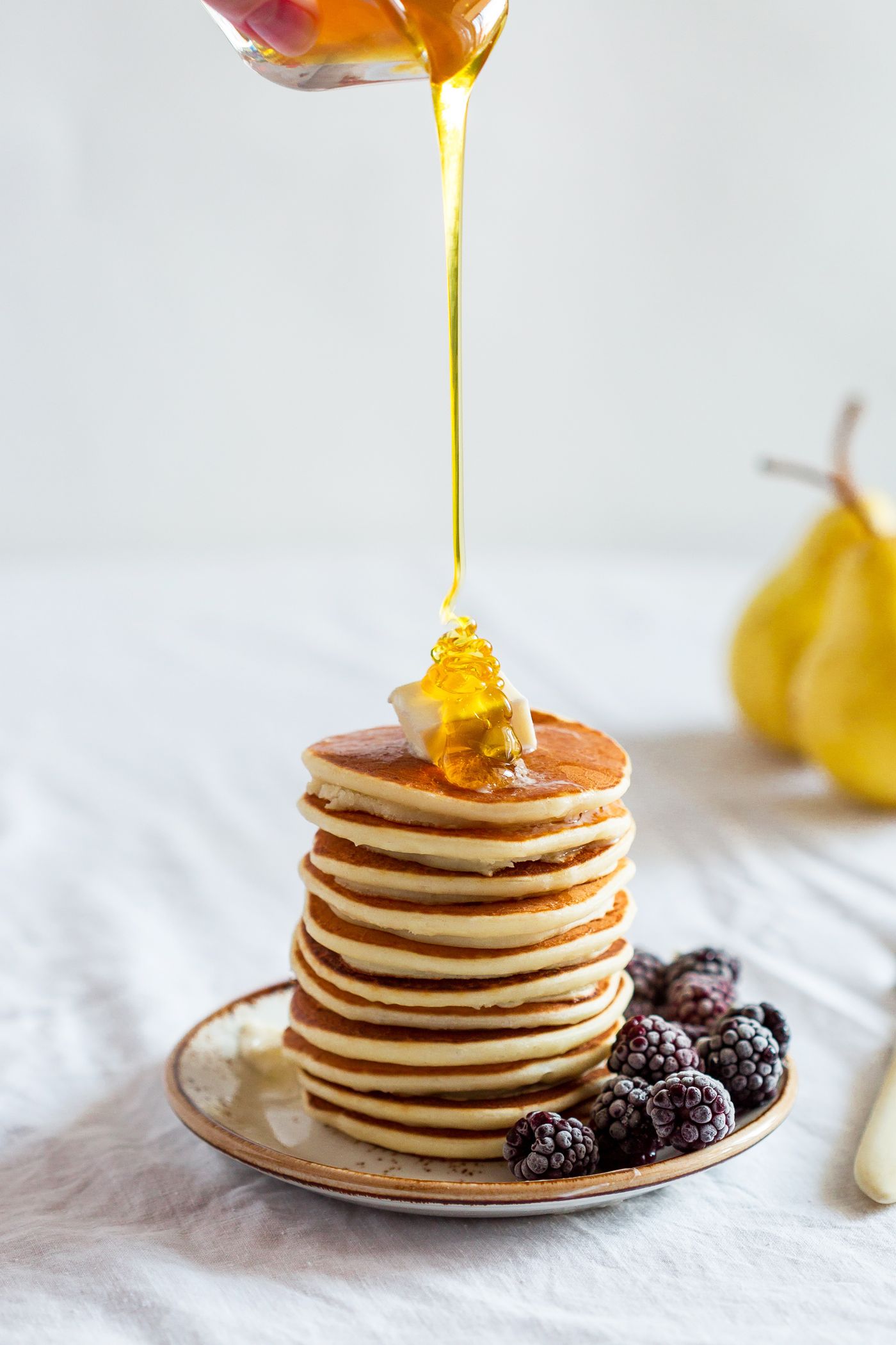 Stack of pancakes with honey