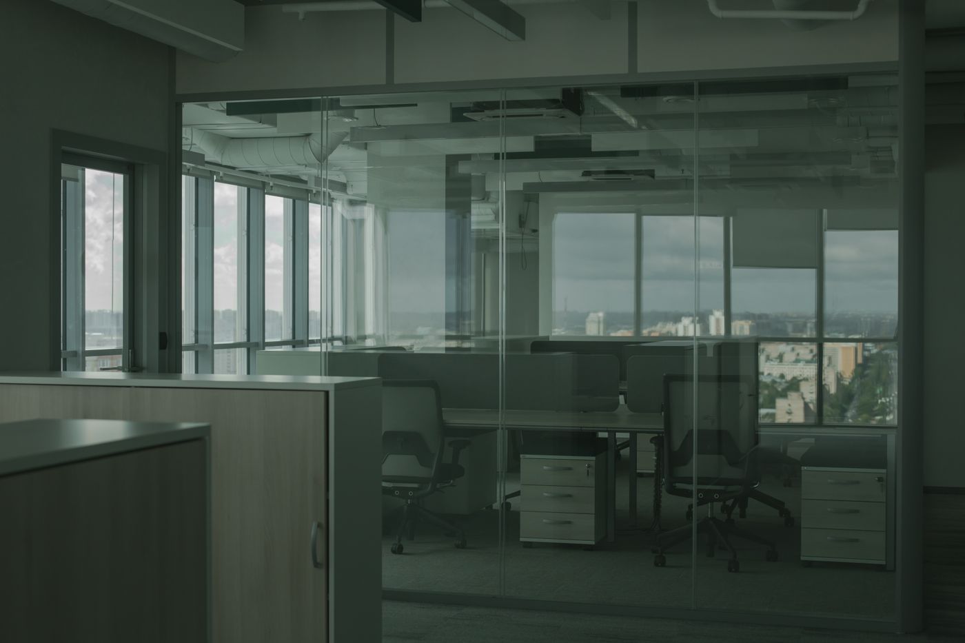 A calm, modern meeting room with a city view