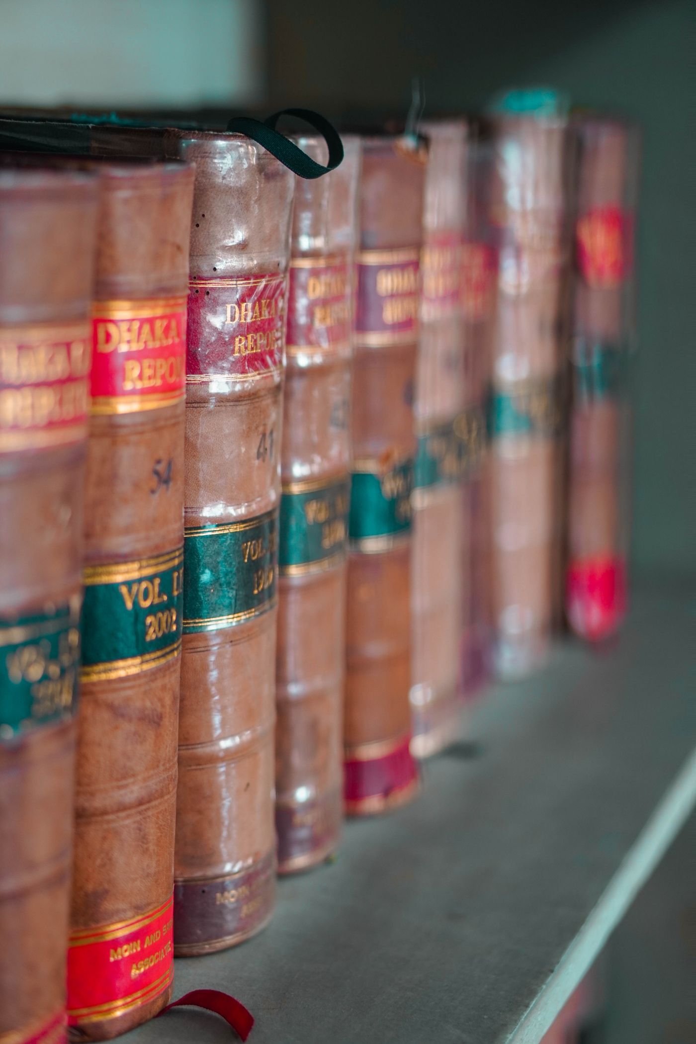 Leather-bound law report volumes on a shelf