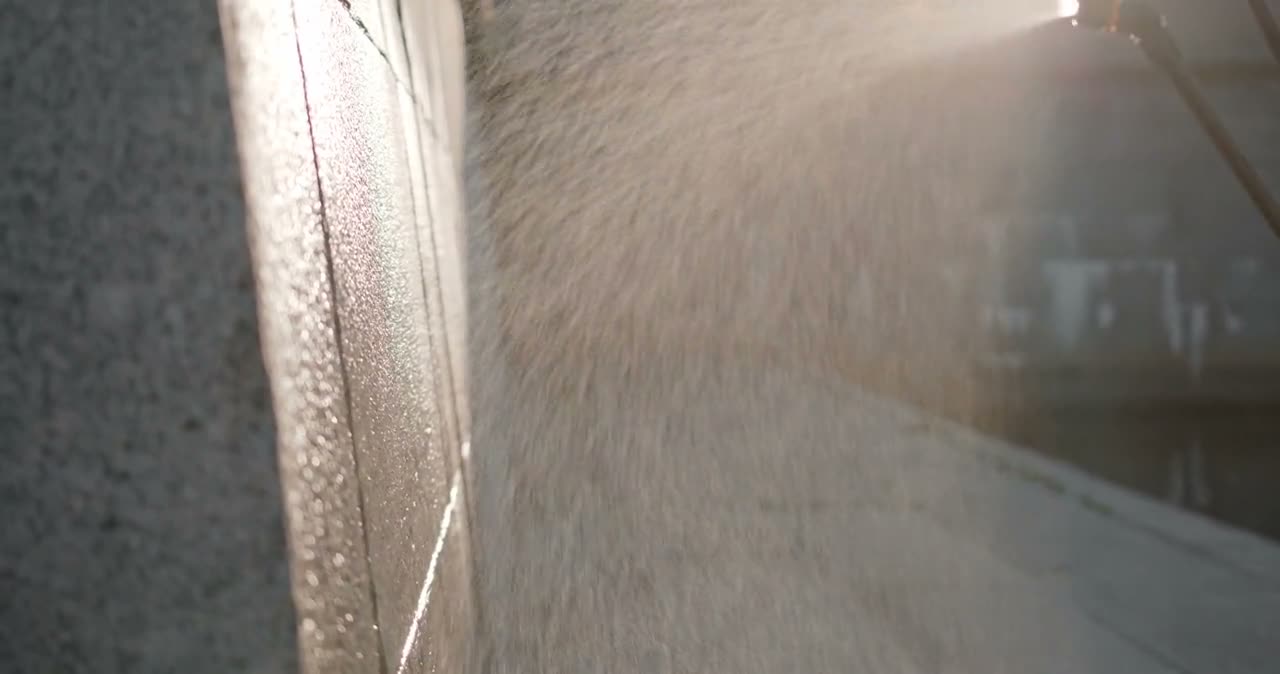 High-pressure water jet hitting a hard surface