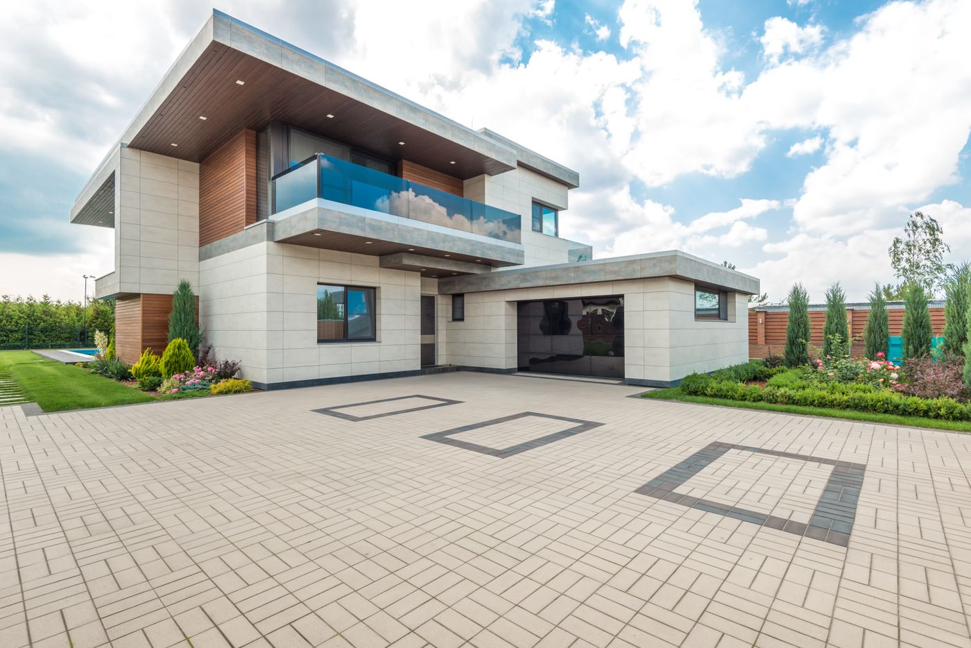 Clean paved driveway in front of a modern home