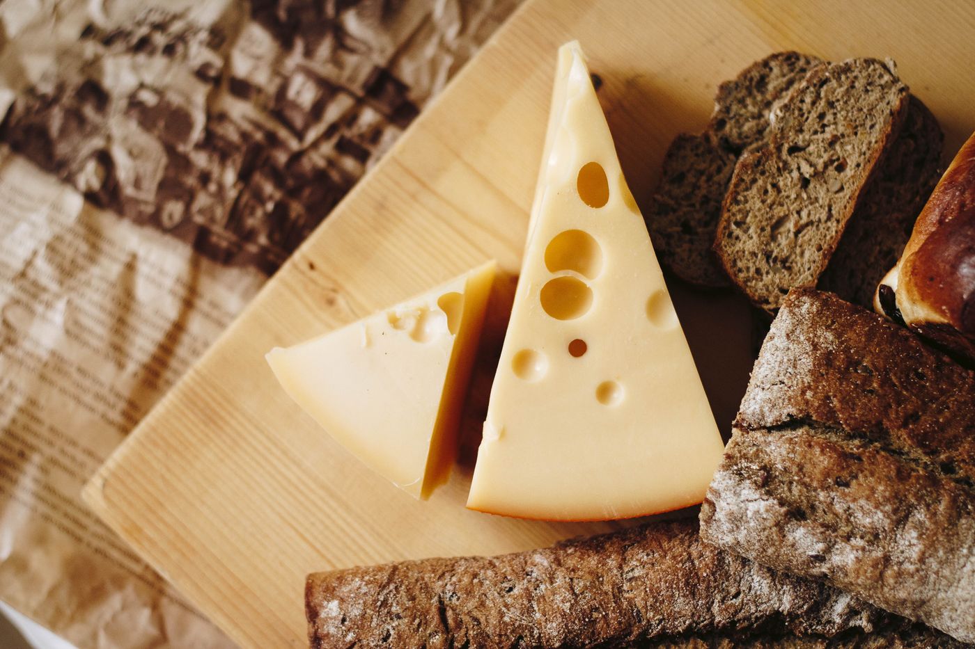 European cheeses and dark rye on a board