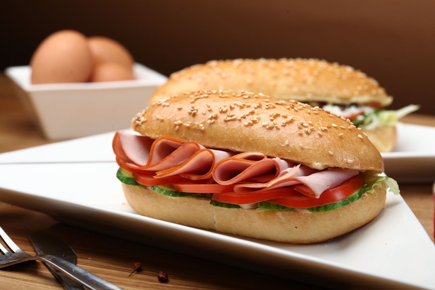 A fresh deli sandwich on a seeded roll