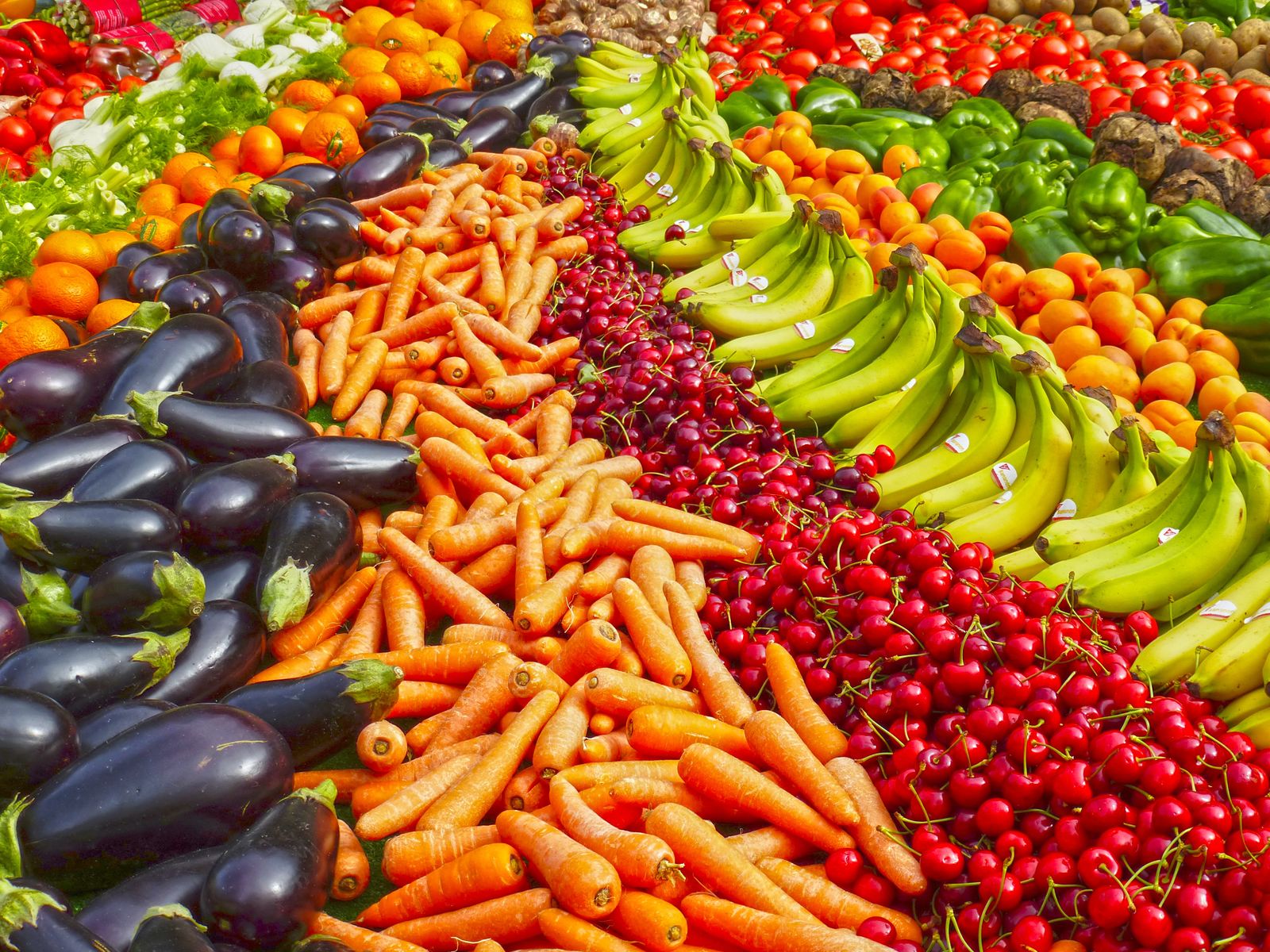 Crates of colourful market vegetables