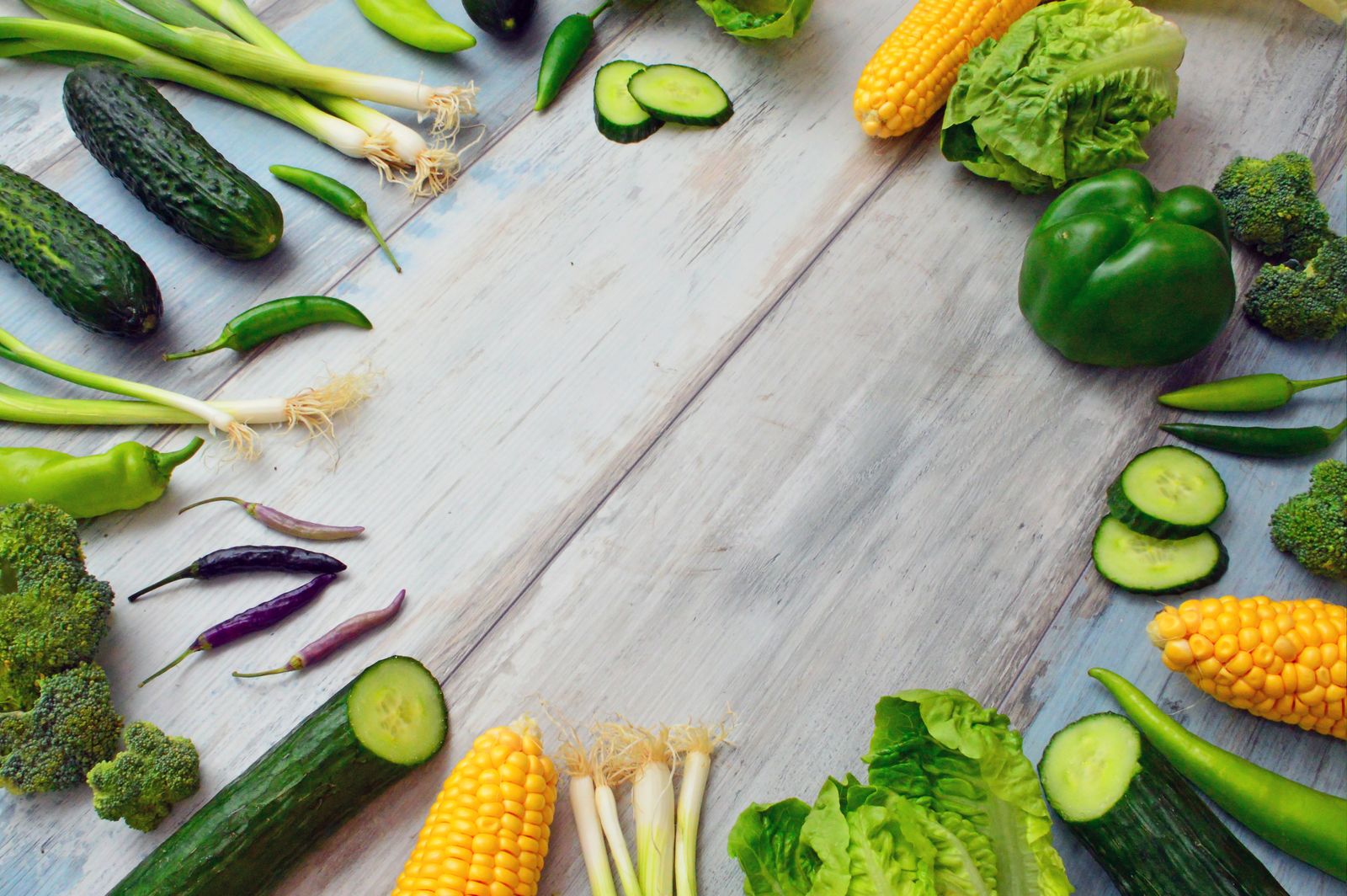 Fresh herbs and vegetables on a board