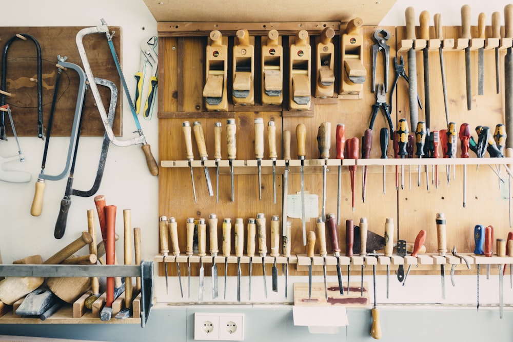 Woodworking and flooring tools on a wall — tools of the trade