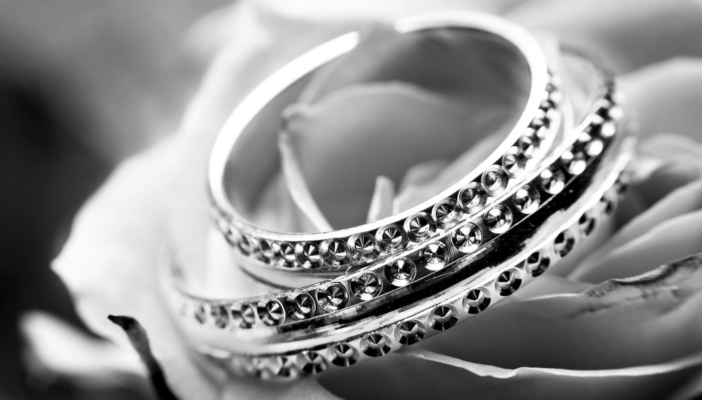 Two diamond-set bands, close up in black and white