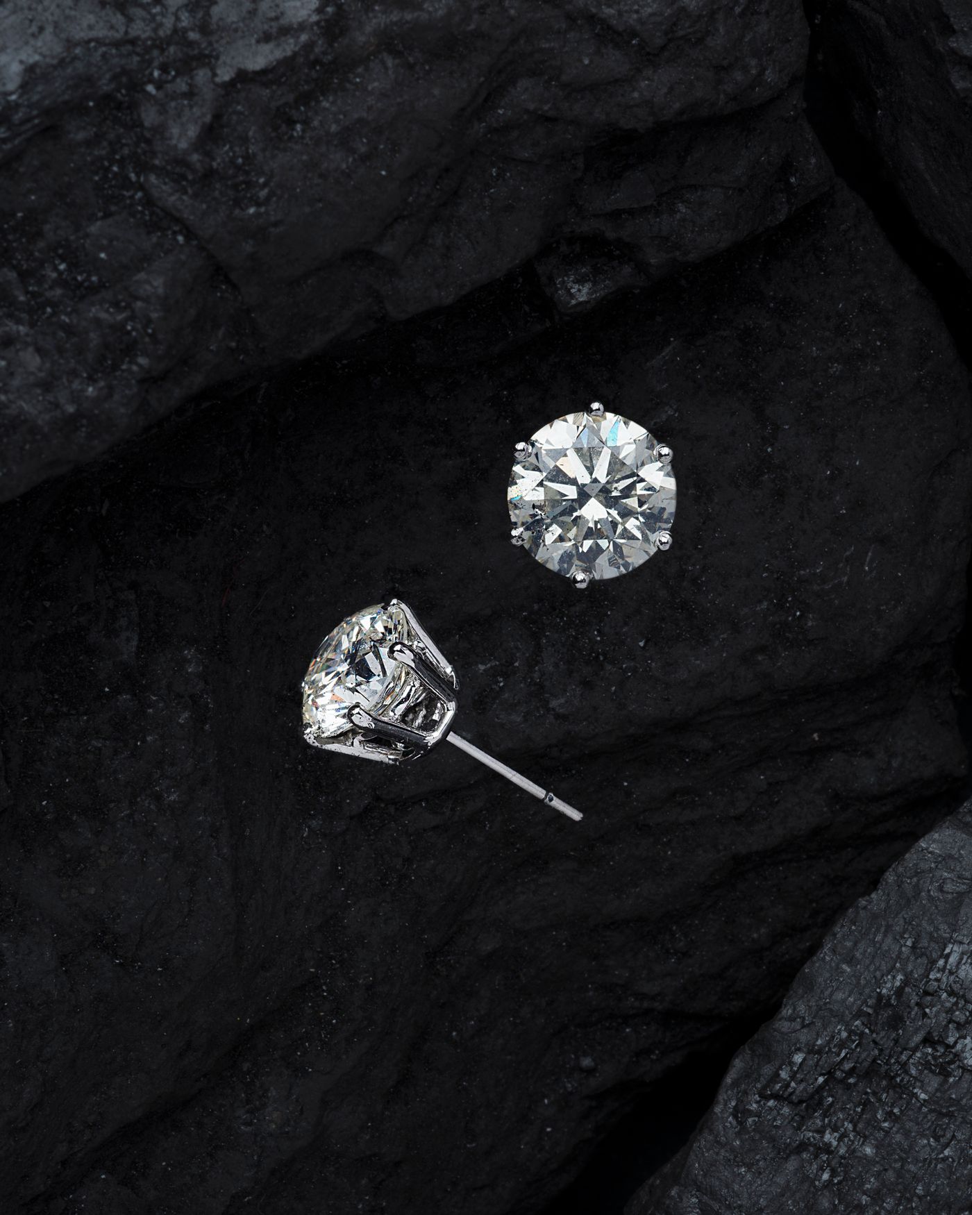 Two diamonds against a dark surface