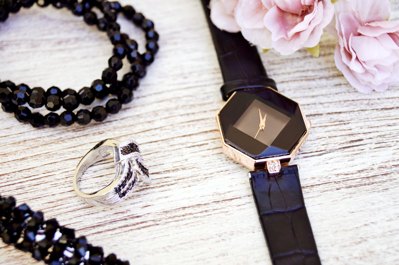 A watch and ring laid out together