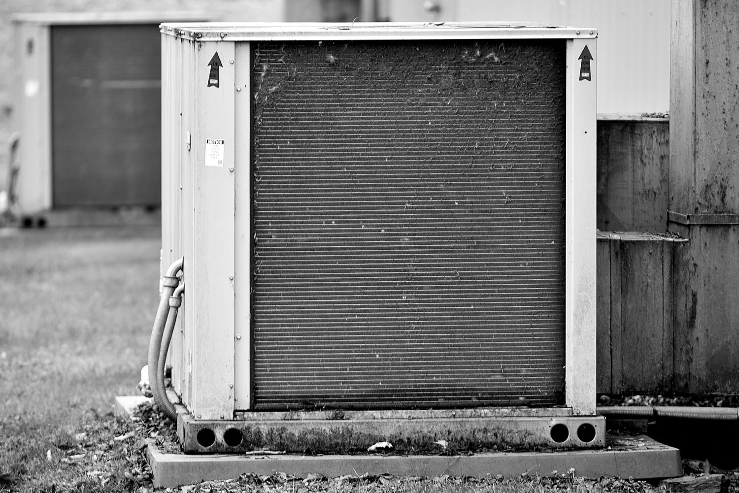 Outdoor HVAC condenser unit, metal texture close-up
