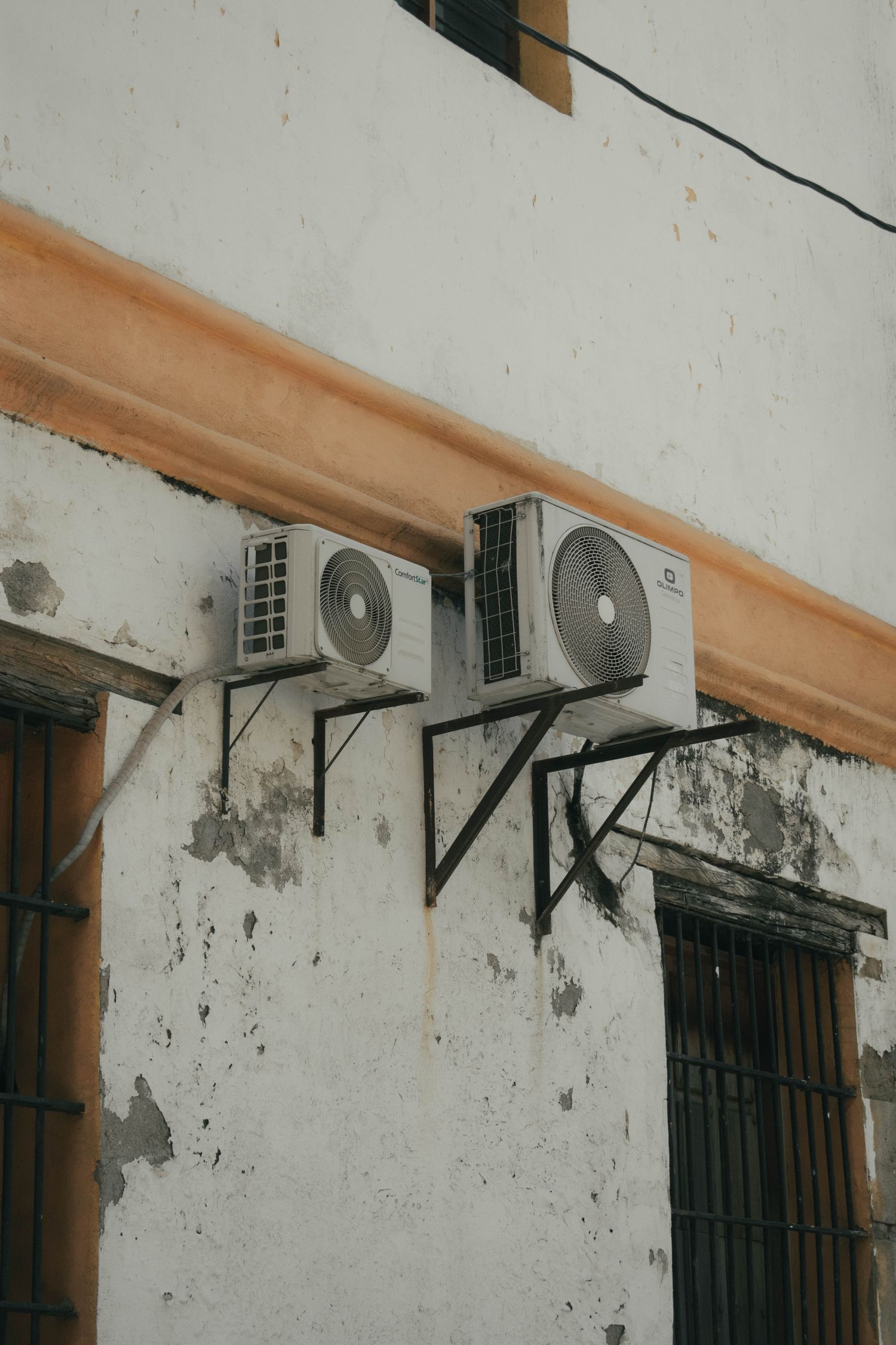 Refrigeration gauges, valves and pump mounted on a wall