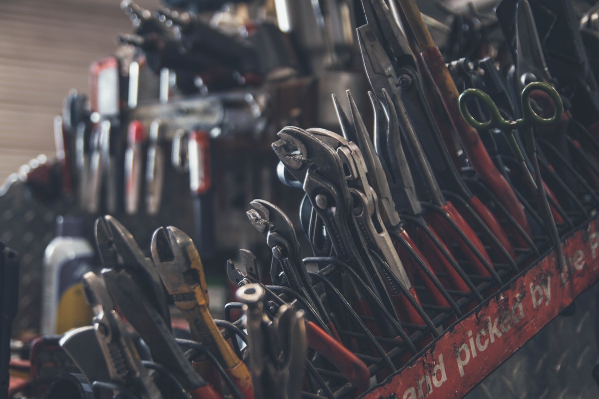 A technician's rack of pliers and hand tools