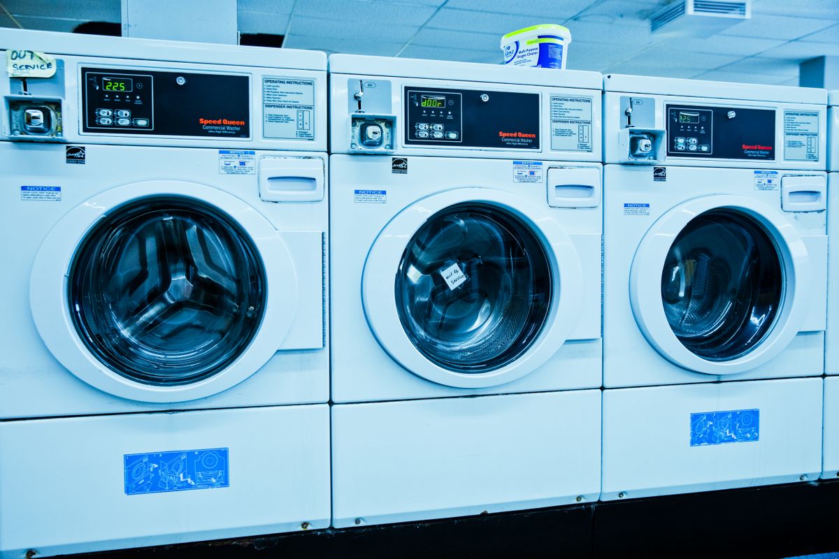 A row of front-load washing machines