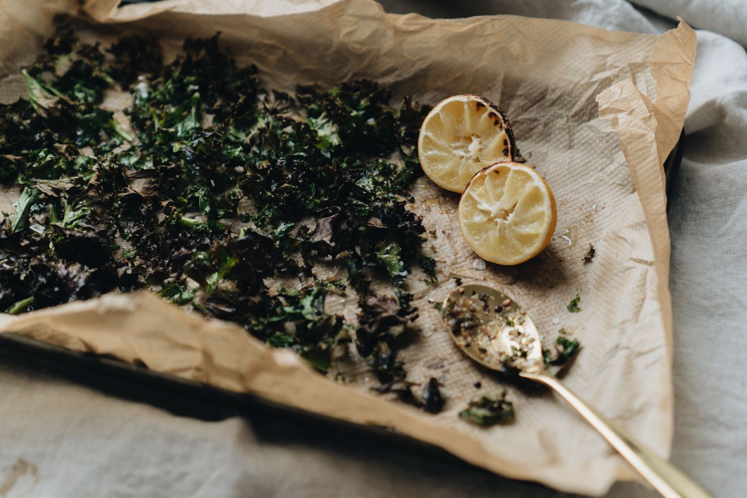 Loose tea leaves on a wooden board