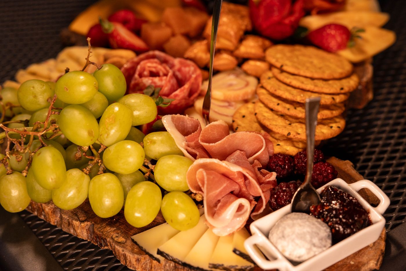 Charcuterie board with cured meats and crackers