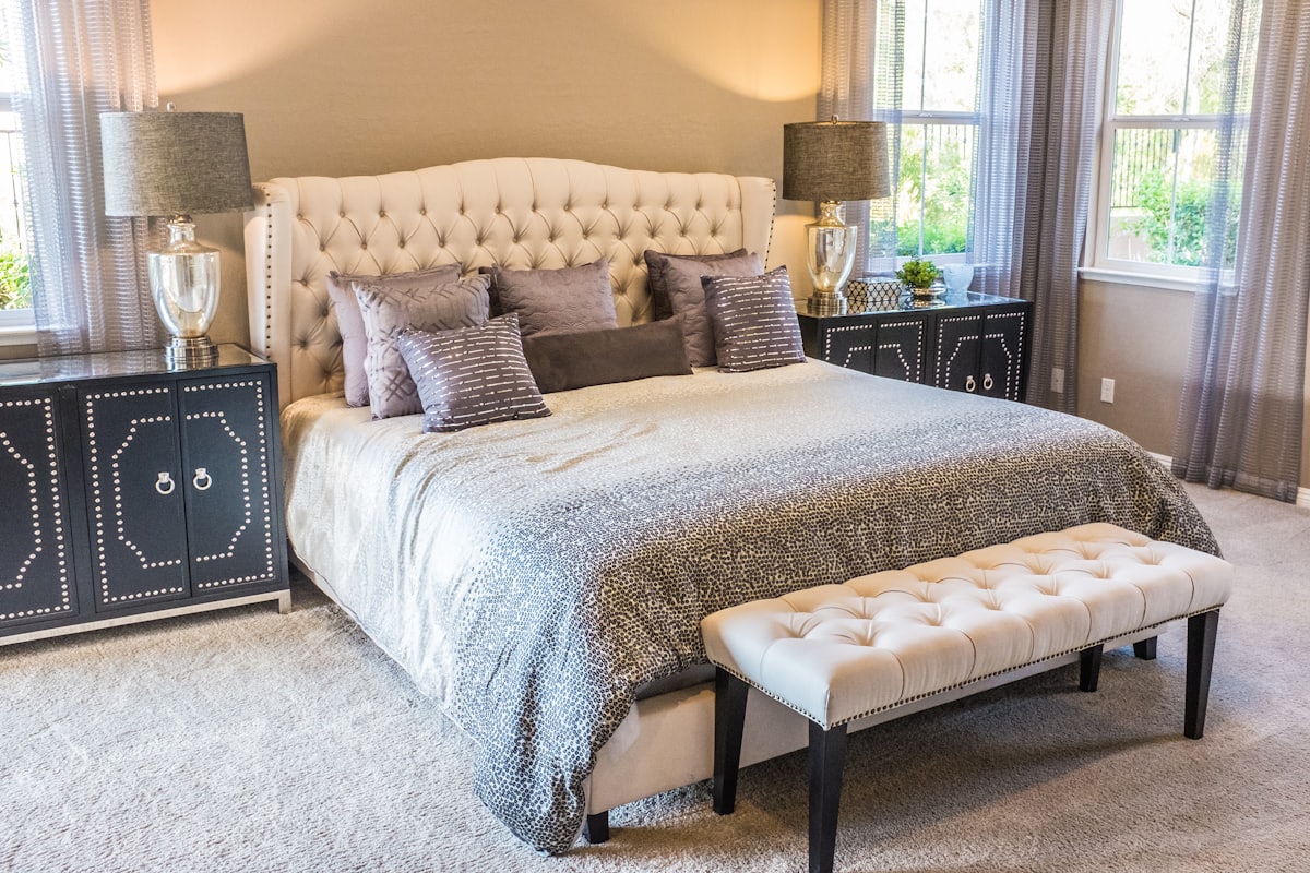 A bedroom dressed with soft coverings