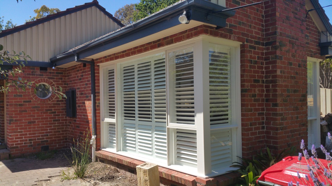 Plantation shutters fitted to a home exterior