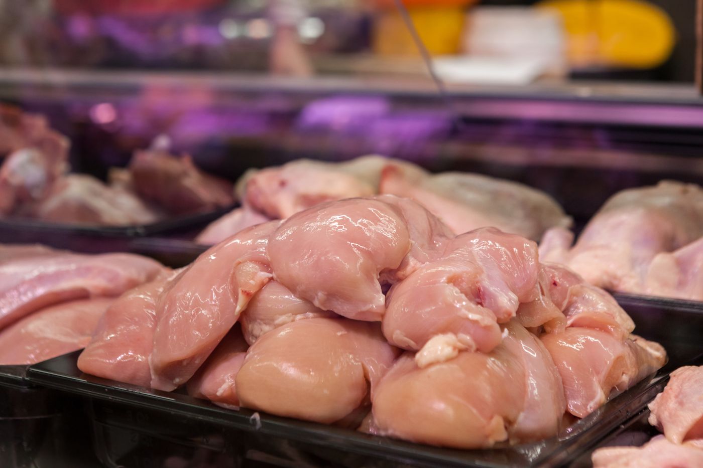 Fresh raw chicken pieces on display